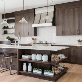 Modern Kitchen with central island and light-colored countertop.