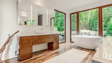 Modern bathroom with bathtub and walk-in shower.