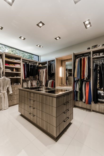 Custom wardrobe design for storing clothing and personal items.