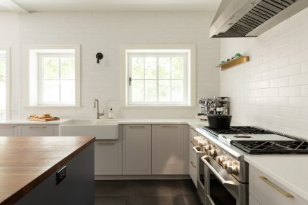 Modern kitchen furniture, cabinets with elegant handles.